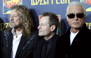 Members of British rock band Led Zeppelin bass player Jones, lead singer Plant and guitarist Page arrive for the premiere of their film "Celebration Day", in New Yor